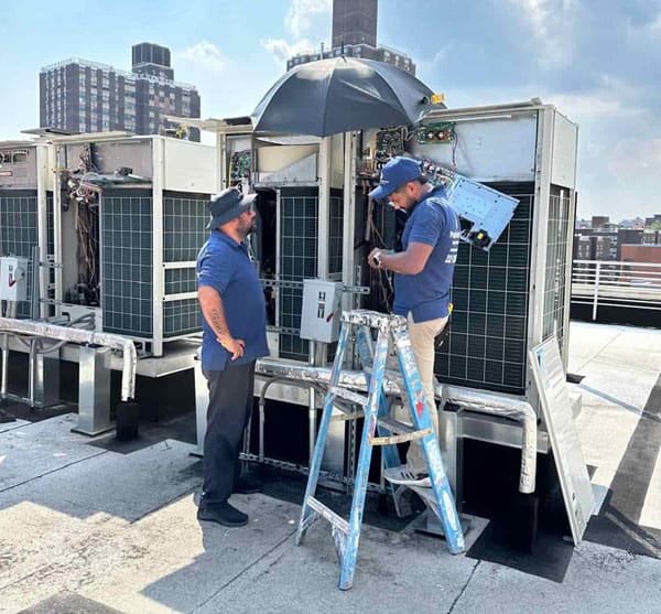 echnician repairing VRV system in New York City